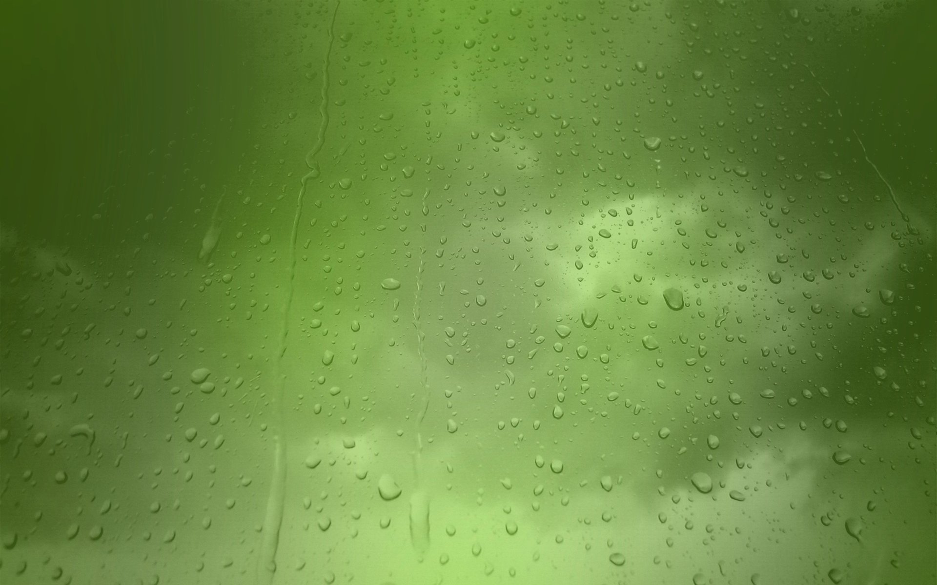 Размытый зеленый фон с каплями дождя