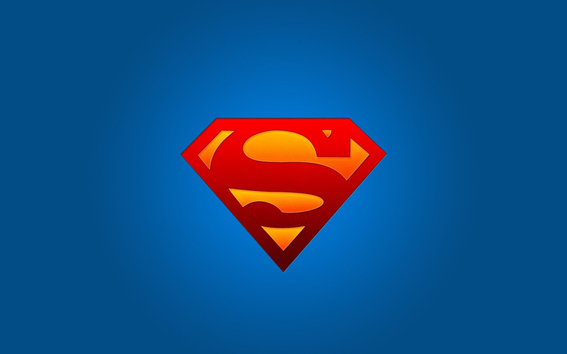 Логотип супермена на синем фоне